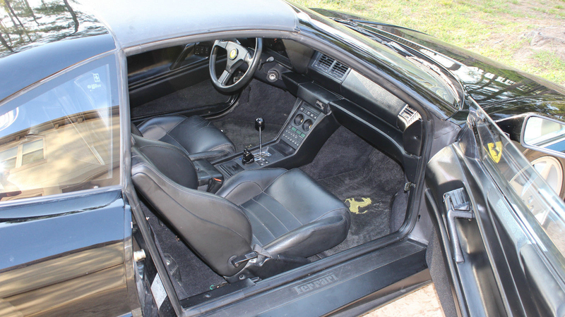 Illustration for article titled Holy Hell, This Gorgeous Black Ferrari Is The Price Of A Used Mustang